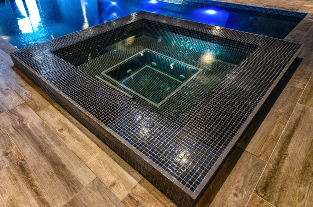 Luxurious spa pool with nested basins and mosaic tiling