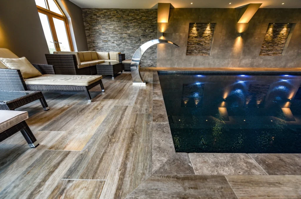 Luxury indoor swimming pool with lounge area and modern design
