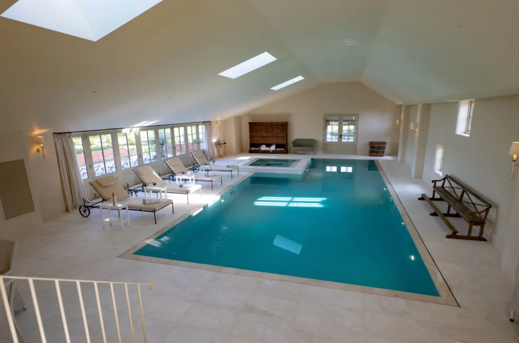 Luxurious indoor swimming pool with spa and lounge area