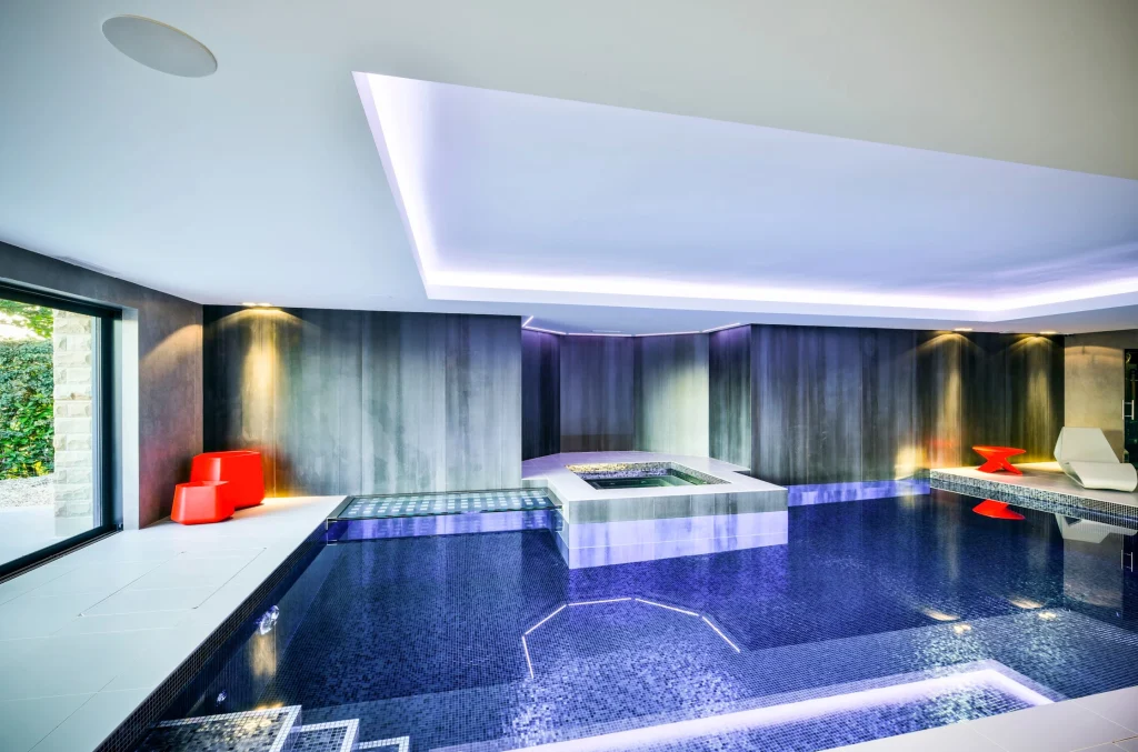 Modern luxury indoor swimming pool with contemporary design elements