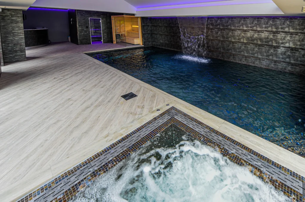 Luxury indoor swimming pool with spa facilities and sauna