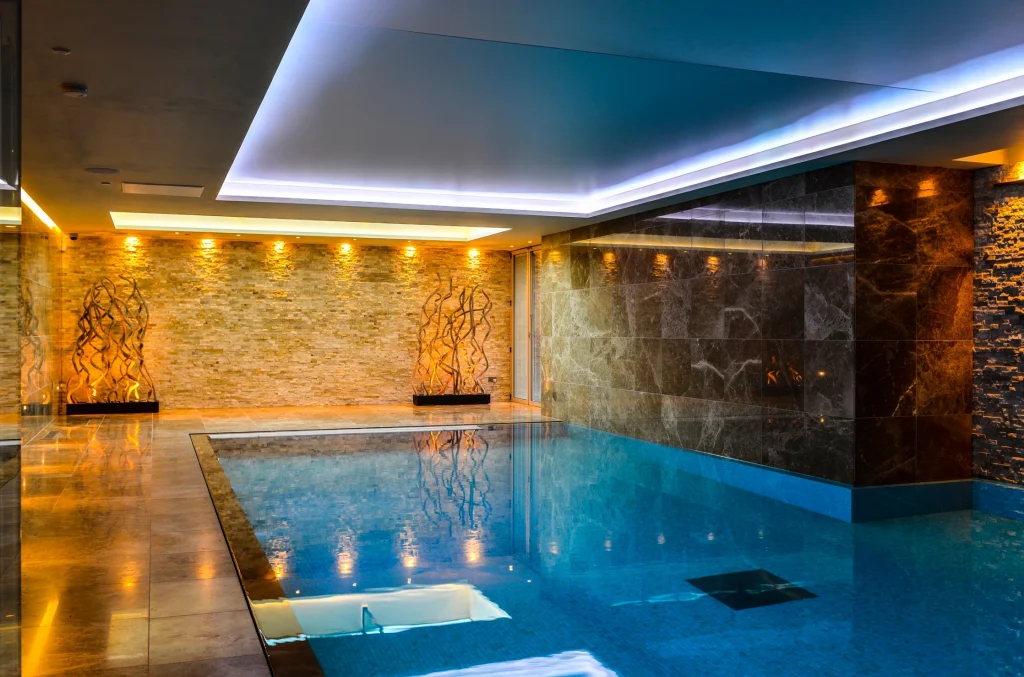 Luxury indoor swimming pool with modern lighting design